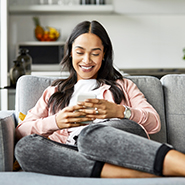 woman smiling using cellphone