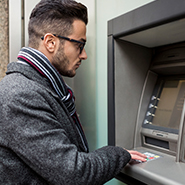 man withdrawing cash at ATM
