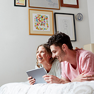 couple looking at tablet