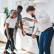 couple looking at a dishwasher