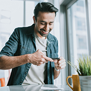man taking a picture with phone