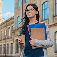 Woman with paperwork and coffee
