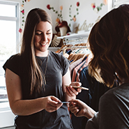 Woman paying with a credit card in a store