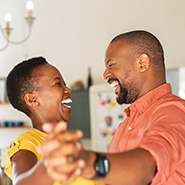 African American mature couple happily dancing