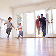 Family of four entering new house
