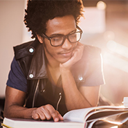 Young man reading a book